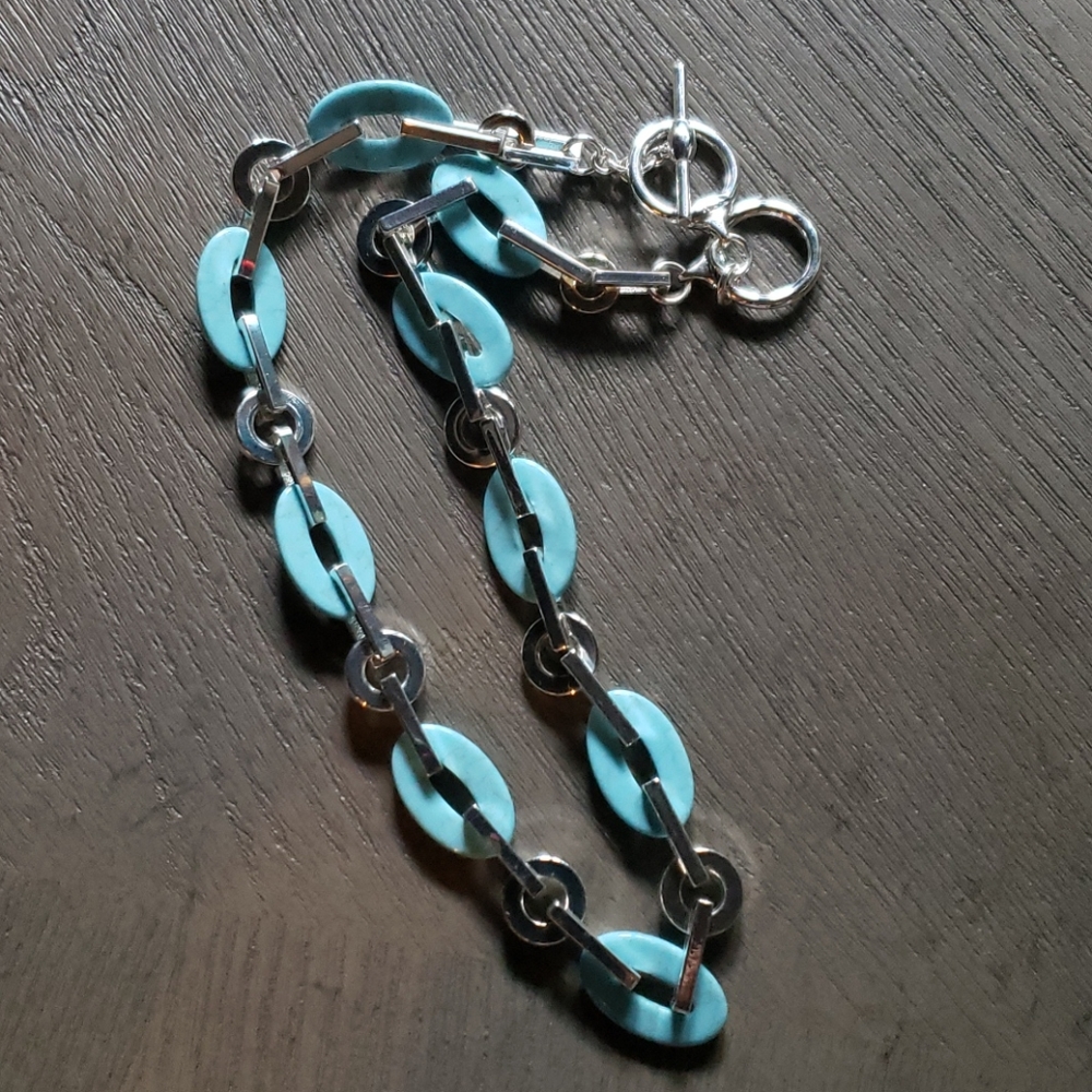 Turquoise and silver necklace.